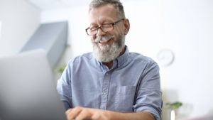 Happy man at laptop