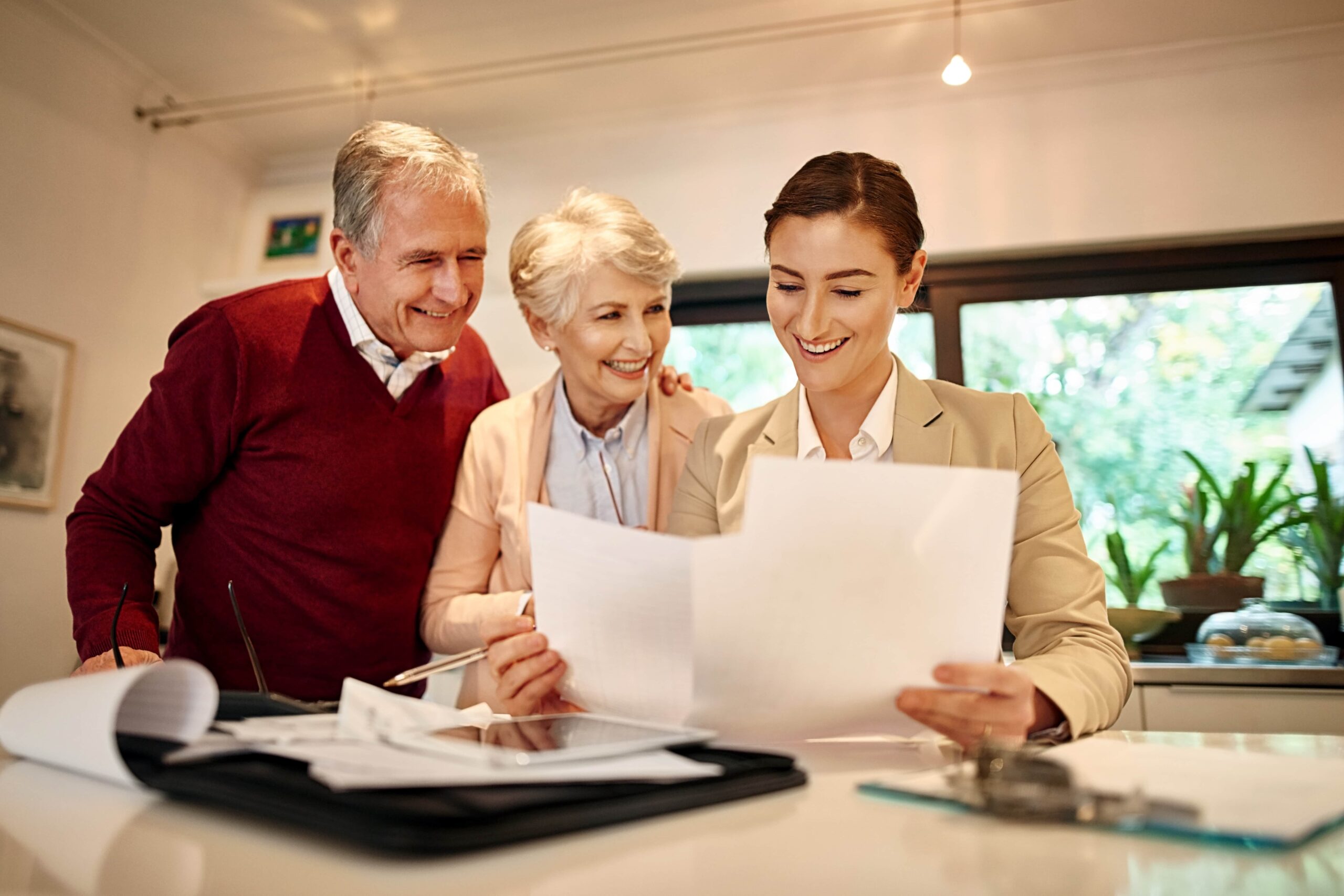 older couple reviewing medicare plans with female insurance agent