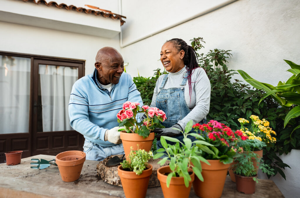 happy couple gardening after working with smartmatch for their medicare needs