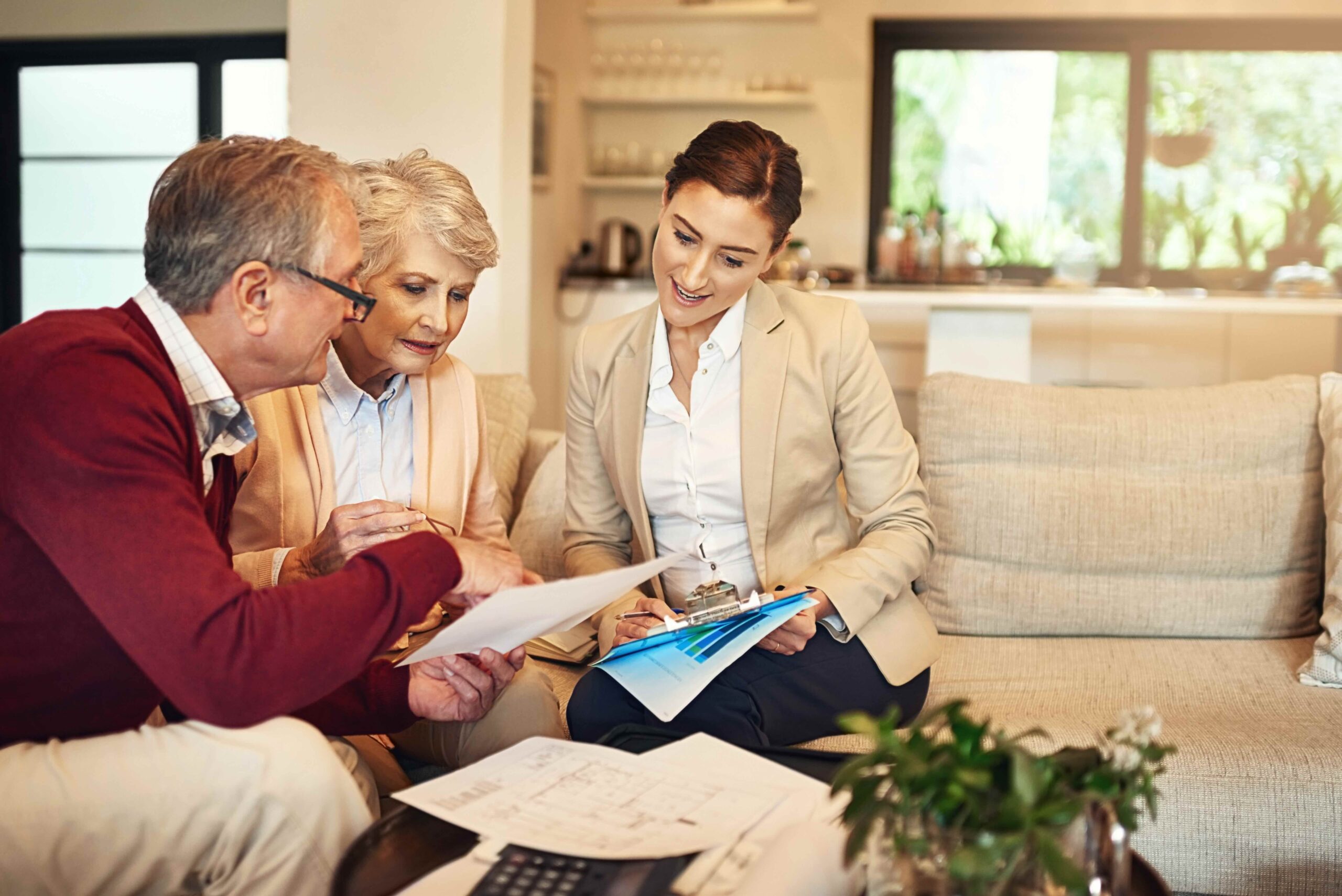 Shot of a senior couple getting advice from their advisor on Medigap underwriting.
